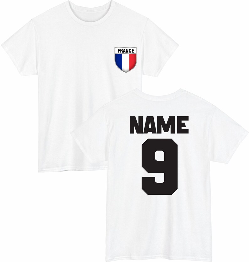 May include: White t-shirt with a French flag emblem on the front and the word "NAME" above the number "9" on the back. The emblem is a shield shape with the colors blue, white, and red. The number 9 is in a bold, black font.