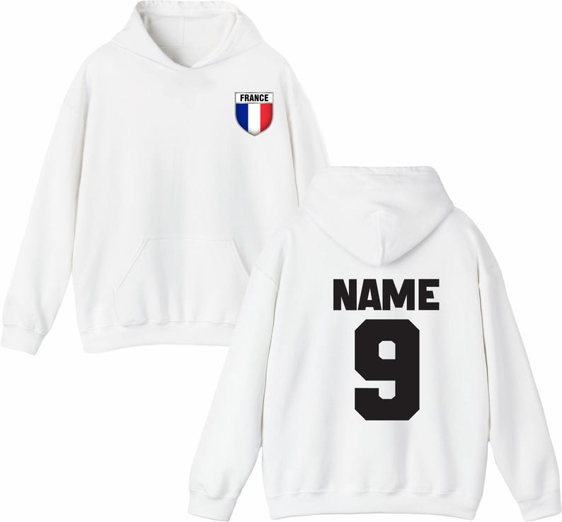 May include: White hoodie with a front pocket and hood. The front features a shield with the French flag and the word "FRANCE". The back displays the word "NAME" above the number "9" in black.