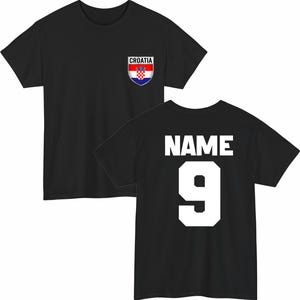 May include: Black t-shirt with a Croatian flag emblem on the front and the word "NAME" and the number "9" on the back. The emblem features a red and white checkered shield with a red and white striped top.