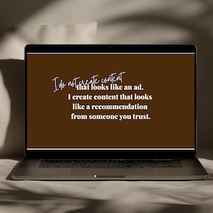 May include: A laptop screen displaying a dark brown background with white text that reads: I do not create content that looks like an ad. I create content that looks like a recommendation from someone you trust. The laptop has a black frame.