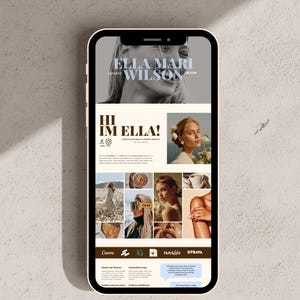 May include: A smartphone displaying a digital portfolio website for a content creator named Ella Mari Wilson. The screen features a black and white header photo, a profile section with text, a grid of lifestyle images, and brand logos including Canva, HubSpot, and Strava.