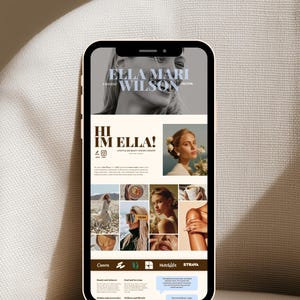 May include: A smartphone displaying a digital portfolio website for Ella Mari Wilson, a content creator. The screen features a black and white header photo, the text "HI IM ELLA!", a grid of lifestyle photographs, and brand logos including Canva and HubSpot.