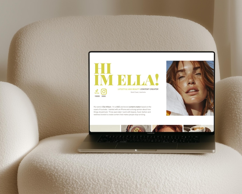 May include: A laptop displaying a website with the text "HI IM ELLA!" in lime green. The website features a photo of a woman and social media icons. The laptop is on a cream-colored, textured armchair.