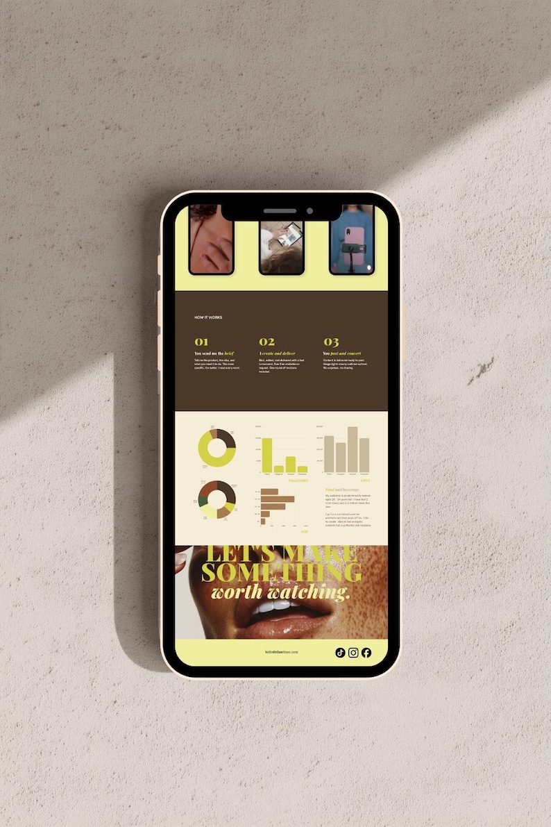 May include: A smartphone displays a website with a brown and yellow color scheme. The website features three small images at the top, followed by numbered sections with text and charts. The phrase "LET'S MAKE SOMETHING worth watching" is at the bottom.
