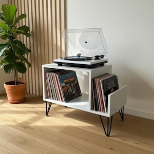Modern record player stand with spacious vinyl storage below and a sturdy top surface for a turntable. Minimalist design made from solid wood, ideal for living room or music corner organization.