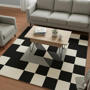 May include: A geometric patterned area rug with a black, white, and gray design. The rug features a checkerboard pattern on the edges and a 3D geometric design in the center. A light wood coffee table with black hairpin legs sits on the rug.