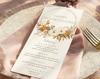 May include: A Thanksgiving menu card featuring a gold circle and a watercolour illustration of pumpkins, leaves, and flowers. The menu includes starters, main course, sides, and dessert. The text reads "Happy Thanksgiving" and "Farthest Star Studios".