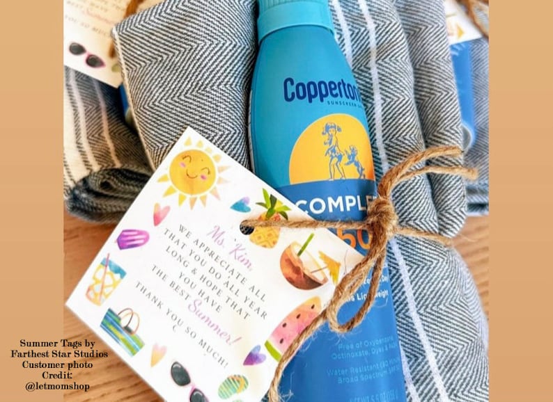 May include: A gift basket for a teacher with a blue and white striped towel, a bottle of sunscreen, and a card that says "We appreciate all that you do all year long & hope that you have the best summer! Thank you so much!"