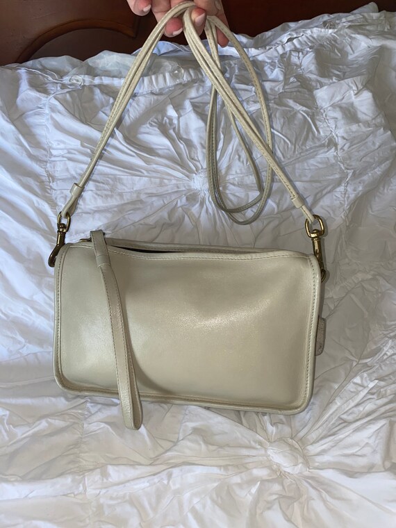 cream coach purse