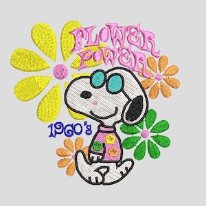May include: Embroidered design featuring Snoopy wearing sunglasses and a pink shirt, surrounded by colorful flowers. The text "FLOWER POWER" and "1960's" are also included in the design. The design is on a light gray background.