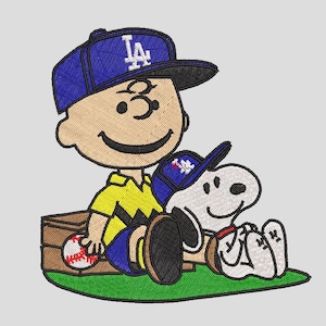 May include: Embroidered image of Charlie Brown and Snoopy wearing blue baseball caps with the LA logo. Charlie Brown is wearing a yellow shirt and blue shorts, holding a baseball. Snoopy is white with black accents.