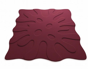 May include: A burgundy-colored rug with an abstract design. The rug has a unique shape with rounded edges and several oval cutouts. The text "RUGS GALLERY" is displayed at the bottom of the image.
