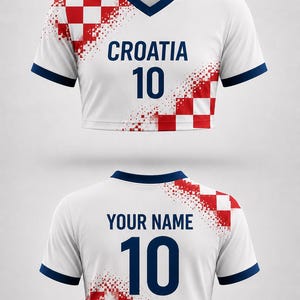 May include: White cropped soccer jersey with navy blue trim and a V-neck. The front features the word "CROATIA" above the number "10" in navy blue. Red and white checkered design on the shoulder. The back has "YOUR NAME" and the number "10".