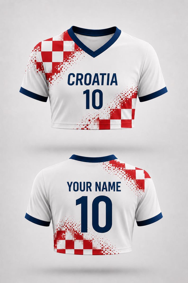 May include: White cropped soccer jersey with navy blue trim and a V-neck. The front features the word "CROATIA" above the number "10" in navy blue. Red and white checkered design on the shoulder. The back has "YOUR NAME" and the number "10".