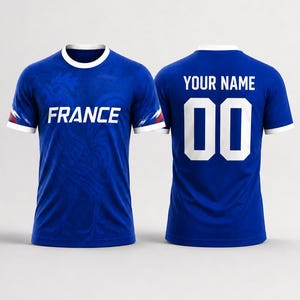 May include: Two blue soccer jerseys. One displays "FRANCE" in white, the other has "YOUR NAME" and the number "00". Both have white trim on the collar and sleeves. The jerseys are a solid blue color with a subtle pattern.