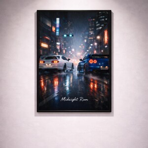 May include: Framed art print featuring two sports cars racing on a wet city street at night. The image has a dark, moody aesthetic with the text "Midnight Run" in the lower center.