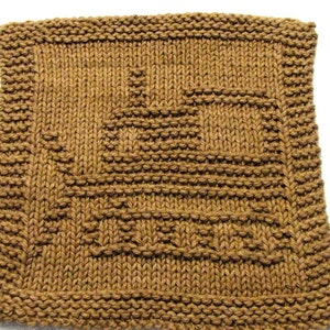 May include: A brown knitted dishcloth with a geometric pattern.