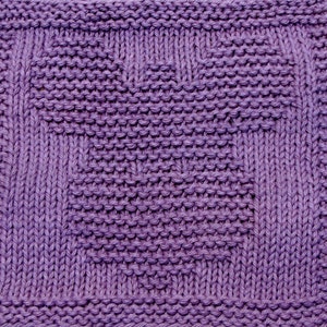 May include: A purple knitted dishcloth with a geometric pattern.