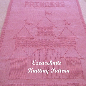 May include: Pink knitted baby blanket featuring a castle design and the word "Princess" at the top. The blanket also includes the text "Ezcareknits Knitting Pattern".