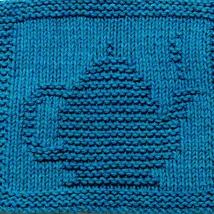 May include: A blue knitted dishcloth with a geometric pattern. The pattern is a series of squares and triangles that create a unique design.