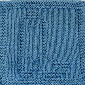 May include: A blue knitted dishcloth with a textured pattern. The dishcloth is made of cotton yarn and is perfect for cleaning dishes and other surfaces.