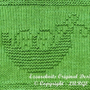 May include: A green knitted dishcloth with a geometric pattern. The dishcloth is made with a simple stitch and has a textured surface. The text "Ezcareknits Original Design © Copyright - LARGE" is printed in white on the bottom right corner of the dishcloth.
