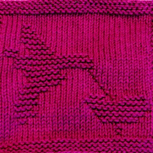 May include: A close-up of a knitted dishcloth in a vibrant magenta color. The cloth features a unique woven pattern with diagonal lines and a textured surface.
