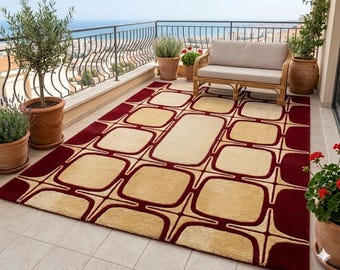 Tappeto moderno geometrico trapuntato a mano, color bordeaux e crema, ideale per il soggiorno.