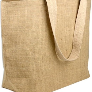 May include: A tan burlap tote bag with light-coloured handles. The bag has a rectangular shape and a simple, natural design. The handles are securely attached to the top, providing a comfortable grip for carrying items.