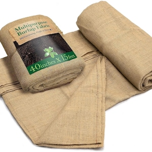 May include: Tan burlap fabric roll with the text "Multipurpose Burlap Fabric" and "40 inches X 15 feet". The fabric is rolled up and spread out, suitable for gardening, crafts, and decor.