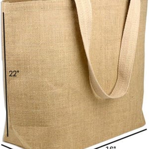 May include: A large, rectangular burlap tote bag with beige handles. The bag is 56 cm tall, 41 cm wide, and 15 cm deep. The natural-colored bag is made of a woven fabric, suitable for carrying groceries or other items.