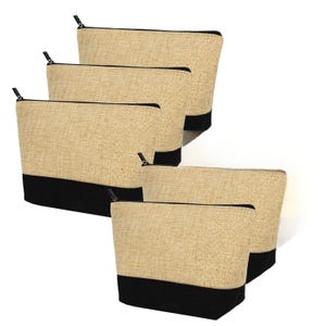 May include: A collection of six beige zippered pouches with black bottoms. The pouches are made of a textured fabric and have black zippers. The pouches are arranged in a slightly overlapping pattern.