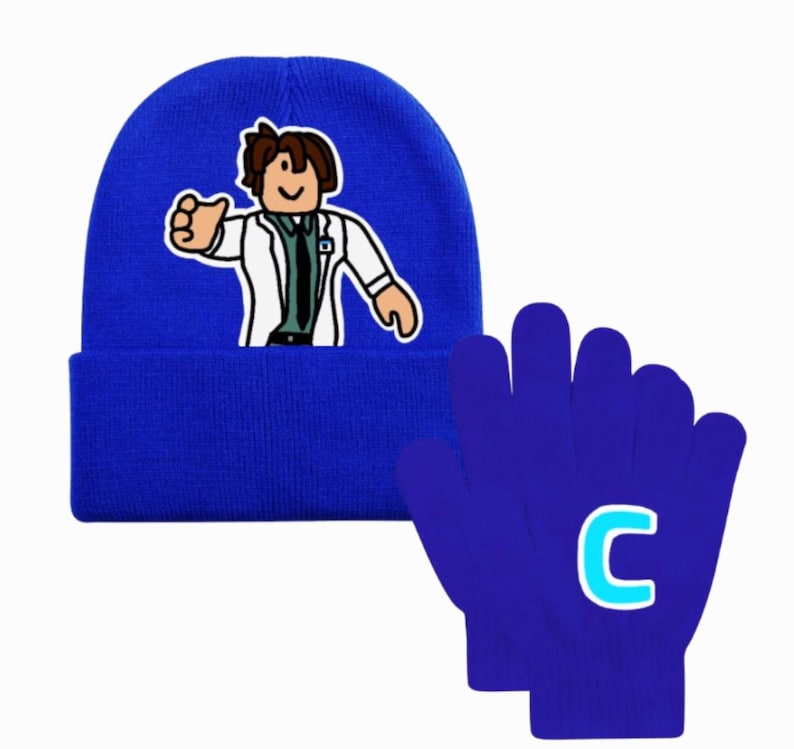 May include: A blue beanie with an embroidered cartoon character in a white lab coat. Beside it are blue gloves with a light blue letter "C" on the back. The beanie and gloves are likely part of a matching set.