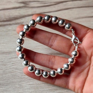 Pulseira de contas grossas em prata de lei 925, joia artesanal.