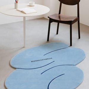 Light Blue Amorphous Plush Rug: Modern Fluid Design