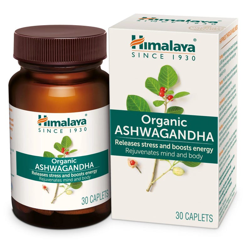 May include: A brown glass bottle and a white box of Himalaya Organic Ashwagandha supplements. The bottle has a brown cap and a white label with green text. The box features the Himalaya logo and text that reads "Releases stress and boosts energy".