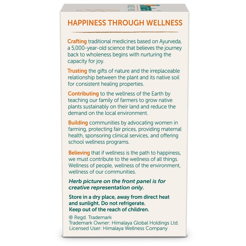 May include: A white product box with the text "HAPPINESS THROUGH WELLNESS" at the top. The box contains detailed information about the product's philosophy, including its Ayurvedic origins and commitment to natural ingredients and community wellness.