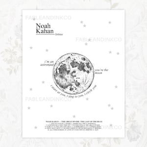 May include: A black and white art print featuring the text "Noah Kahan Orbiter" above a detailed illustration of the moon. The print includes song lyrics and a list of song titles from the album "The Great Divide".