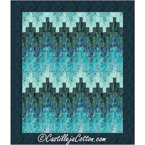 May include: A quilt with a chevron pattern in shades of blue and green. The quilt is made up of small squares and is bordered in a dark blue fabric. The quilt is signed "CastillejaCotton.com" in the bottom right corner.