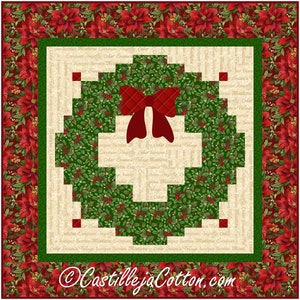 May include: A festive Christmas quilt with a wreath design and a red plaid bow. The wreath is composed of green leaves and red berries, set against a cream background with text. The border features red poinsettias.