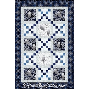 May include: A quilted fabric with a repeating pattern of owls on branches, set against white and navy blue squares. The quilt has a dark blue border with a floral design and the text "CastillejaCotton.com".