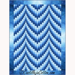May include: A blue and white quilt with a geometric pattern. The quilt is made up of squares and triangles, and the colors gradually transition from dark blue to light blue.