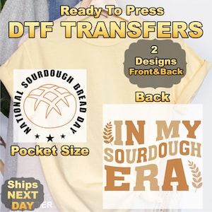 May include: A light yellow t-shirt with DTF TRANSFERS text. The shirt features two designs: a pocket-sized "National Sourdough Bread Day" graphic and a larger "In My Sourdough Era" design. The image also includes text that says "2 Designs Front & Back".