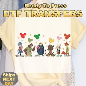 May include: A light yellow t-shirt with a DTF transfer design. The text "Ready To Press DTF TRANSFERS" is at the top. The design features cartoon characters holding balloon bouquets. The characters are from the movie Zootopia.