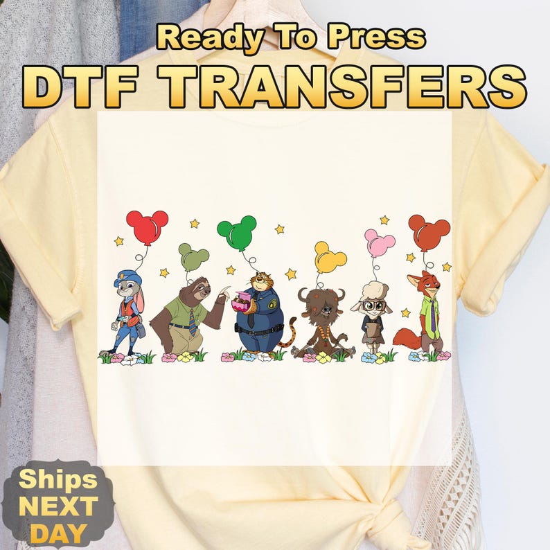 May include: A light yellow t-shirt with a DTF transfer design. The text "Ready To Press DTF TRANSFERS" is at the top. The design features cartoon characters holding balloon bouquets. The characters are from the movie Zootopia.