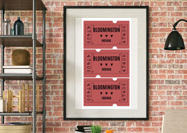 May include: Framed print featuring three vintage-style tickets. Each ticket is a shade of red with the text "BLOOMINGTON" and "INDIANA", along with the number "47405". The tickets have a decorative border and heart symbols.