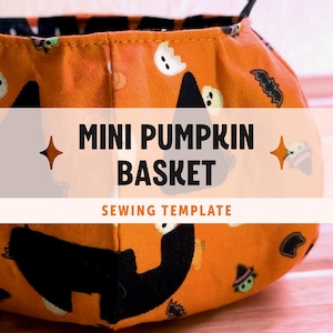 May include: A fabric basket featuring an orange background with a repeating pattern of black witch hats, white ghosts, and small bats. The text MINI PUMPKIN BASKET SEWING TEMPLATE is printed in black and orange across the center of the basket.