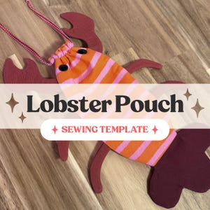 May include: A lobster-shaped pouch with a drawstring closure, featuring orange and pink horizontal stripes on the body, dark red felt-like claws and tail, and two black button eyes. The text Lobster Pouch Sewing Template is overlaid.