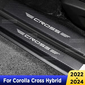 May include: Black car door sill protectors with the word "CROSS" in white, accompanied by three parallel lines. The text "For Corolla Cross Hybrid" and the years "2022-2024" are displayed in the image.