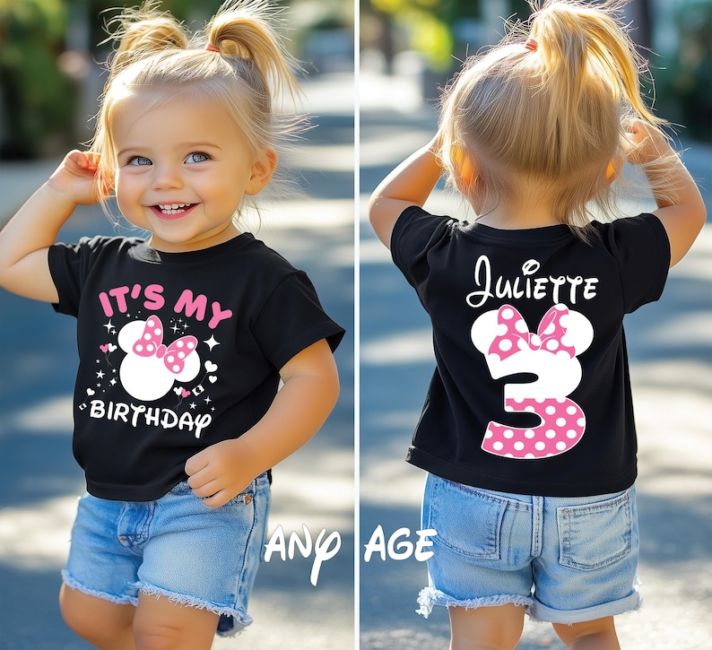 May include: Black t-shirt with a Minnie Mouse design for a child's birthday. The front says "It's My Birthday" with a Minnie Mouse graphic and the back has the name "Juliette" and the number "3". The child is wearing blue denim shorts.